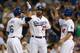 LOS ANGELES, CA - AUGUST 24: Andre Ethier #16, Matt Kemp #24, and Mark Ellis #14 of the Los Angeles Dodgers celebrate after all three score on Ethier's three run home run in the first inning against the Miami Marlins on August 24, 2012 at Dodger Stadium in Los Angeles, California. (Photo by Stephen Dunn/Getty Images)