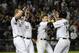 August 24, 2012; Chicago, IL, USA; Chicago White Sox first baseman Paul Konerko (14) is greeted by Adam Dunn (32), Tyler Flowers (17) and (15) after hitting a game winning two-run double against the Seattle Mariners in the ninth inning at U.S. Cellular Field. The Chicago White Sox defeated the Seattle Mariners 9-8. Mandatory Credit: David Banks-USA TODAY Sports