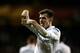 LONDON, ENGLAND - FEBRUARY 14: Gareth Bale of Spurs celebrates after scoring his team's match winning second goal from a free kick during the UEFA Europa League round of 32 first leg match between Tottenham Hotspur and Olympique Lyonnais at White Hart Lane on February 14, 2013 in London, England. (Photo by Paul Gilham/Getty Images)