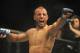 Jan 12, 2013; Oklahoma City, OK, USA; Tarec Saffiedine (red and black shorts) celebrates after his match with Nate Marquardt (not shown) in their Strikeforce MMA Welterweight Title bout at the Chesapeake Energy Arena. Mandatory Credit: Mark D. Smith-USA TODAY Sports