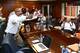 The Auburn coaching staff celebrates when Montravius Adams announces for Auburn. Photo credit: Todd Van Emst