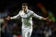 LONDON, ENGLAND - FEBRUARY 14: Gareth Bale of Spurs celebrates after scoring his team's match winning second goal from a free kick during the UEFA Europa League round of 32 first leg match between Tottenham Hotspur and Olympique Lyonnais at White Hart Lane on February 14, 2013 in London, England. (Photo by Paul Gilham/Getty Images)