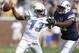 Oct 27, 2012; Atlanta, GA, USA; Brigham Young Cougars linebacker Ezekiel Ansah (right) prepares to sack Georgia Tech Yellow Jackets quarterback Tevin Washington (13) during the first quarter at Bobby Dodd Stadium. Mandatory Credit: Josh D. Weiss-USA TODAY Sports