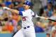 October 2, 2012; Los Angeles, CA, USA; Los Angeles Dodgers first baseman Adrian Gonzalez (23) hits a pop fly for an out in the second inning against the San Francisco Giants at Dodger Stadium. Mandatory Credit: Gary A. Vasquez-USA TODAY Sports