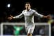 LONDON, ENGLAND - FEBRUARY 14: Gareth Bale of Spurs celebrates after scoring his team's match winning second goal from a free kick during the UEFA Europa League round of 32 first leg match between Tottenham Hotspur and Olympique Lyonnais at White Hart Lane on February 14, 2013 in London, England. (Photo by Paul Gilham/Getty Images)