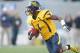 December 1, 2012; Morgantown, WV, USA; West Virginia Mountaineers running back Tavon Austin (1) rushes the ball against the Kansas Jayhawks during the first quarter at Milan Puskar Stadium. The West Virginia Mountaineers won 59-10. Mandatory Credit: Charles LeClaire-USA TODAY Sports