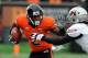 CORVALLIS, OR - DECEMBER 01: Wide receiver Markus Wheaton #2 of the Oregon State Beavers applies a stiff arm to defensive back Darvin Butler #39 of the Nicholls State Colonels in the second quarter of the game on December 1, 2012 at Reser Stadium in Corvallis, Oregon. (Photo by Steve Dykes/Getty Images)