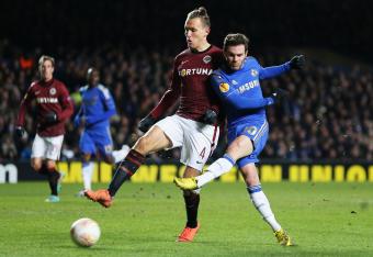 Ondrej Svejdik rubs Juan Mata off the ball at Stamford Bridge.