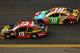DAYTONA BEACH, FL - FEBRUARY 21: Clint Bowyer, driver of the #15 5-hour ENERGY Toyota, races Kyle Busch, driver of the #18 M&M's Toyota, during the NASCAR Sprint Cup Series Budweiser Duel 2 at Daytona International Speedway on February 21, 2013 in Daytona Beach, Florida. (Photo by Mike Ehrmann/Getty Images)