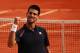 PARIS, FRANCE - JUNE 08: Novak Djokovic of Serbia celebrates victory in his men's singles semi final match against Roger Federer of Switzerland during day 13 of the French Open at Roland Garros on June 8, 2012 in Paris, France. (Photo by Clive Brunskill/Getty Images)