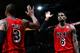 ATLANTA, GA - FEBRUARY 20: LeBron James #6 of the Miami Heat reacts with Dwyane Wade #3 after hitting a three-point basket against the Atlanta Hawks as time expired in the first half at Philips Arena on February 20, 2013 in Atlanta, Georgia. NOTE TO USER: User expressly acknowledges and agrees that, by downloading and or using this photograph, User is consenting to the terms and conditions of the Getty Images License Agreement. (Photo by Kevin C. Cox/Getty Images)