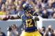 MORGANTOWN, WV - SEPTEMBER 29: Geno Smith #12 of the West Virginia Mountaineers drops back to pass against the Baylor Bears during the game on September 29, 2012 at Mountaineer Field in Morgantown, West Virginia. (Photo by Justin K. Aller/Getty Images)