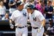 NEW YORK - JUNE 20: Mark Teixeira #25 (2-R) of the New York Yankees celebrates his third inning grand slam against the New York Mets with teammate Derek Jeter #2 on June 20, 2010 at Yankee Stadium in the Bronx borough of New York City. (Photo by Jim McIsaac/Getty Images)