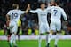MADRID, SPAIN - OCTOBER 20: Cristiano Ronaldo of Real Madrid CF celebrates scoring their second goal with teammates Luka Modric (L) and Mezut Ozil (2ndL) during the La Liga match between Real Madrid CF and RC Deportivo La Coruna at Bernabeu on October 20, 2012 in Madrid, Spain. (Photo by Gonzalo Arroyo Moreno/Getty Images)