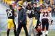 PITTSBURGH, PA - DECEMBER 23: Heath Miller #83 of the Pittsburgh Steelers is helped off of the field following an injury by teammate Brett Keisel #99 of the Pittsburgh Steelers during the game at Heinz Field on December 23, 2012 in Pittsburgh, Pennsylvania. (Photo by Jared Wickerham/Getty Images)