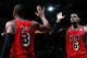 ATLANTA, GA - FEBRUARY 20: LeBron James #6 of the Miami Heat reacts with Dwyane Wade #3 after hitting a three-point basket against the Atlanta Hawks as time expired in the first half at Philips Arena on February 20, 2013 in Atlanta, Georgia. NOTE TO USER: User expressly acknowledges and agrees that, by downloading and or using this photograph, User is consenting to the terms and conditions of the Getty Images License Agreement. (Photo by Kevin C. Cox/Getty Images)