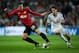 MADRID, SPAIN - FEBRUARY 13: Robin van Persie (L) of Manchester United duels for the ball with Angel Di Maria of Real Madrid during the UEFA Champions League Round of 16 first leg match between Real Madrid and Manchester United at Estadio Santiago Bernabeu on February 13, 2013 in Madrid, Spain. (Photo by Jasper Juinen/Getty Images)