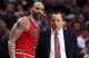 Feb 11, 2013; Chicago, IL, USA; Chicago Bulls head coach Tom Thibodeau (right) talks with power forward Carlos Boozer (5) during the third quarter against the San Antonio Spurs at the United Center. The Spurs won 103-89. Mandatory Credit: Jerry Lai-USA TODAY Sports
