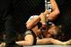 Feb 23, 2013; Anaheim, CA, USA; Ronda Rousey (black shorts) and Liz Carmouche (white shorts) fight during their UFC women's world bantamweight championship bout at the Honda Center. Mandatory Credit: Jayne Kamin-Oncea-USA TODAY Sports
