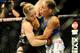 Feb 23, 2013; Anaheim, CA, USA; Ronda Rousey (black shorts) and Liz Carmouche (white shorts) fight during their UFC women's world bantamweight championship bout at the Honda Center. Mandatory Credit: Jayne Kamin-Oncea-USA TODAY Sports