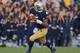 SOUTH BEND, IN - NOVEMBER 17: Everett Golson #5 of the Notre Dame Fighting Irish rolls out against the Wake Forest Demon Deacons at Notre Dame Stadium on November 17, 2012 in South Bend, Indiana. Notre Dame defeated Wake Forest 38-0. (Photo by Jonathan Daniel/Getty Images)