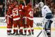 Feb 21, 2013; Detroit, MI, USA; Detroit Red Wings center Joakim Andersson (63) congratulated by teammates after scoring a goal as Vancouver Canucks goalie Roberto Luongo (1) reacts in the third period at Joe Louis Arena. Detroit won 8-3. Mandatory Credit: Rick Osentoski-USA TODAY Sports