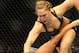 Feb 23, 2013; Anaheim, CA, USA; Ronda Rousey (black shorts) and Liz Carmouche (white shorts) fight during their UFC women's world bantamweight championship bout at the Honda Center. Mandatory Credit: Jayne Kamin-Oncea-USA TODAY Sports