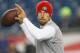 FOXBORO, MA - DECEMBER 16: Alex Smith #11 of the San Francisco 49ers warms up before a game with the New England Patriots at Gillette Stadium on December 16, 2012 in Foxboro, Massachusetts. (Photo by Jim Rogash/Getty Images)