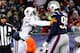 FOXBORO, MA - DECEMBER 30: Reggie Bush #22 of the Miami Dolphins shoves Chandler Jones #95 of the New England Patriots following a play during the game at Gillette Stadium on December 30, 2012 in Foxboro, Massachusetts. (Photo by Jared Wickerham/Getty Images)