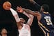NEW YORK, NY - NOVEMBER 18: Carmelo Anthony #7 of the New York Knicks gets the shot off against Roy Hibbert #55 of the Indiana Pacers at Madison Square Garden on November 18, 2012 in New York City. NOTE TO USER: User expressly acknowledges and agrees that, by downloading and/or using this photograph, user is consenting to the terms and conditions of the Getty Images License Agreement. (Photo by Bruce Bennett/Getty Images)