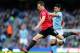 MANCHESTER, ENGLAND - DECEMBER 09: Jonny Evans of Manchester United in action during the Barclays Premier League match between Manchester City and Manchester United at the Etihad Stadium on December 9, 2012 in Manchester, England. (Photo by Clive Mason/Getty Images)