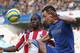 LONDON, ENGLAND - FEBRUARY 17: Clayton Donaldson of Brentford (l) is tackled by John Terry of Chelsea during the FA Cup Fourth Round Replay match between Chelsea and Brentford at Stamford Bridge on February 17, 2013 in London, England. (Photo by Ian Walton/Getty Images)