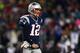 FOXBORO, MA - JANUARY 20: Tom Brady #12 of the New England Patriots walks off the field after a play against the Baltimore Ravens during the 2013 AFC Championship game at Gillette Stadium on January 20, 2013 in Foxboro, Massachusetts. (Photo by Elsa/Getty Images)