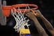 HOUSTON, TX - APRIL 04: A Connecticut Huskies player cuts down the net after defeating the Butler Bulldogs to win the National Championship Game of the 2011 NCAA Division I Men's Basketball Tournament by a score of 53-41 at Reliant Stadium on April 4, 2011 in Houston, Texas. (Photo by Streeter Lecka/Getty Images)