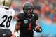 DALLAS, TX - JANUARY 01: Joseph Randle #1 of the Oklahoma State Cowboys runs the ball against the Purdue Boilermakers during the Heart of Dallas Bowl at Cotton Bowl on January 1, 2013 in Dallas, Texas. (Photo by Ronald Martinez/Getty Images)