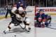 UNIONDALE, NY - FEBRUARY 26: Chris Kelly #23 of the Boston Bruins carries the puck around Matt Martin #17 of the New York Islanders at the Nassau Veterans Memorial Coliseum on February 26, 2013 in Uniondale, New York. (Photo by Bruce Bennett/Getty Images)