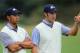 MELBOURNE, AUSTRALIA - NOVEMBER 19: (L-R) Tiger Woods of the U.S. Team and teammate Dustin Johnson talk on the eighth hole during the Day Three Morning Foursome Matches of the 2011 Presidents Cup at Royal Melbourne Golf Course on November 19, 2011 in Melbourne, Australia. (Photo by David Cannon/Getty Images)