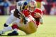 SAN FRANCISCO, CA - NOVEMBER 11: Quarterback Alex Smith #11 of the San Francisco 49ers gets hit by linebacker Jo-Lonn Dunbar #52 of the St. Louis Rams during a run in the first quarter on November 11, 2012 at Candlestick Park in San Francisco, California. (Photo by Brian Bahr/Getty Images)