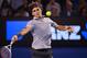 Jan 25, 2013; Melbourne, AUSTRALIA; Roger Federer (SUI) returns a shot against Andy Murray (GBR) on day twelve of the 2013 Australian Open at Melbourne Park. Murray won 6-4, 6-7, 6-3, 6-7, 6-2. Mandatory Credit: Pierre Lahalle/Presse Sports via USA TODAY Sports
