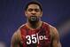 Feb 25, 2013; Indianapolis, IN, USA; Texas A&M Aggies defensive lineman Damontre Moore watches others run the 40 yard dash after he pulled up during the NFL Combine at Lucas Oil Stadium. Mandatory Credit: Brian Spurlock-USA TODAY Sports