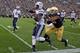 SOUTH BEND, IN - OCTOBER 20: Jamaal Williams #21 of the BYU Courgars is pushed out of bounds by Matthias Farley #41 of the Notre Dame Fighting Irish at Notre Dame Stadium on October 20, 2012 in South Bend, Indiana. (Photo by Jonathan Daniel/Getty Images)