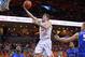 February 28, 2013; Charlottesville, VA USA; Virginia Cavaliers guard Joe Harris (12) shoots the ball past Duke Blue Devils forward Mason Plumlee (5) in the first half at John Paul Jones Arena. Mandatory Credit: Geoff Burke-USA TODAY Sports