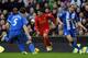 LIVERPOOL, ENGLAND - NOVEMBER 17: Luis Suarez of Liverpool runs at the Wigan Athletic defence during the Barclays Premier League match between Liverpool and Wigan Athletic at Anfield on November 17, 2012 in Liverpool, England. (Photo by Chris Brunskill/Getty Images)