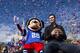 LAKE BUENA VISTA, FL - FEBRUARY 04: In this handout photo provided by Disney Parks, Super Bowl XLVII MVP Joe Flacco rides with Mickey Mouse in a parade through the Magic Kingdom at Walt Disney World Resort February 4, 2013 in Lake Buena Vista, Florida. Flacco led his Baltimore Ravens to a 34-31 win over the San Francisco 49ers last night in New Orleans. After the game, Flacco starred in a commercial where he proclaimed 'I'm Going to Disney World!' (Photo by Matt Stroshane/Disney Parks via Getty Images)