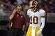 Washington Redskins head coach Mike Shanahan and quarterback Robert Griffin III share a moment early in the 2012 regular season.
