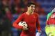 WIGAN, ENGLAND - MARCH 02: Luis Suarez of Liverpool walks off with the match ball after scoring a hat trick in the Barclays Premier League match between Wigan Athletic and Liverpool at the DW Stadium on March 2, 2013 in Wigan, England. (Photo by Alex Livesey/Getty Images)