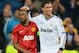 MADRID, SPAIN - FEBRUARY 13: Patrice Evra of Manchester United and Cristiano Ronaldo of Real Madrid at the final whistle during the UEFA Champions League Round of 16 first leg match between Real Madrid and Manchester United at Estadio Santiago Bernabeu on February 13, 2013 in Madrid, Spain. (Photo by Mike Hewitt/Getty Images)