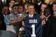 Kodi Burns presenting a jersey to President Obama (courtesy of zimbio.com)