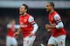 LONDON, ENGLAND - FEBRUARY 23: Santi Cazorla of Arsenal celebrates scoring to make it 1-0 with Theo Walcott during the Barclays Premier League match between Arsenal and Aston Villa at the Emirates Stadium on February 23, 2013 in London, England. (Photo by Michael Regan/Getty Images)
