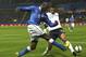 PARMA, ITALY - NOVEMBER 14: Mario Balotelli (L) of Italy competes for the ball with Etienne Capoue of France during the international friendly match between Italy and France at Stadio Ennio Tardini on November 14, 2012 in Parma, Italy. (Photo by Marco Luzzani/Getty Images)